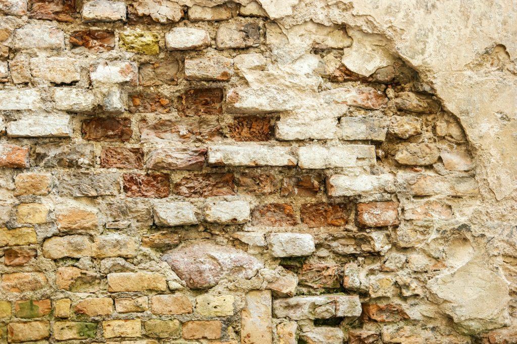 Damaged brick wall.